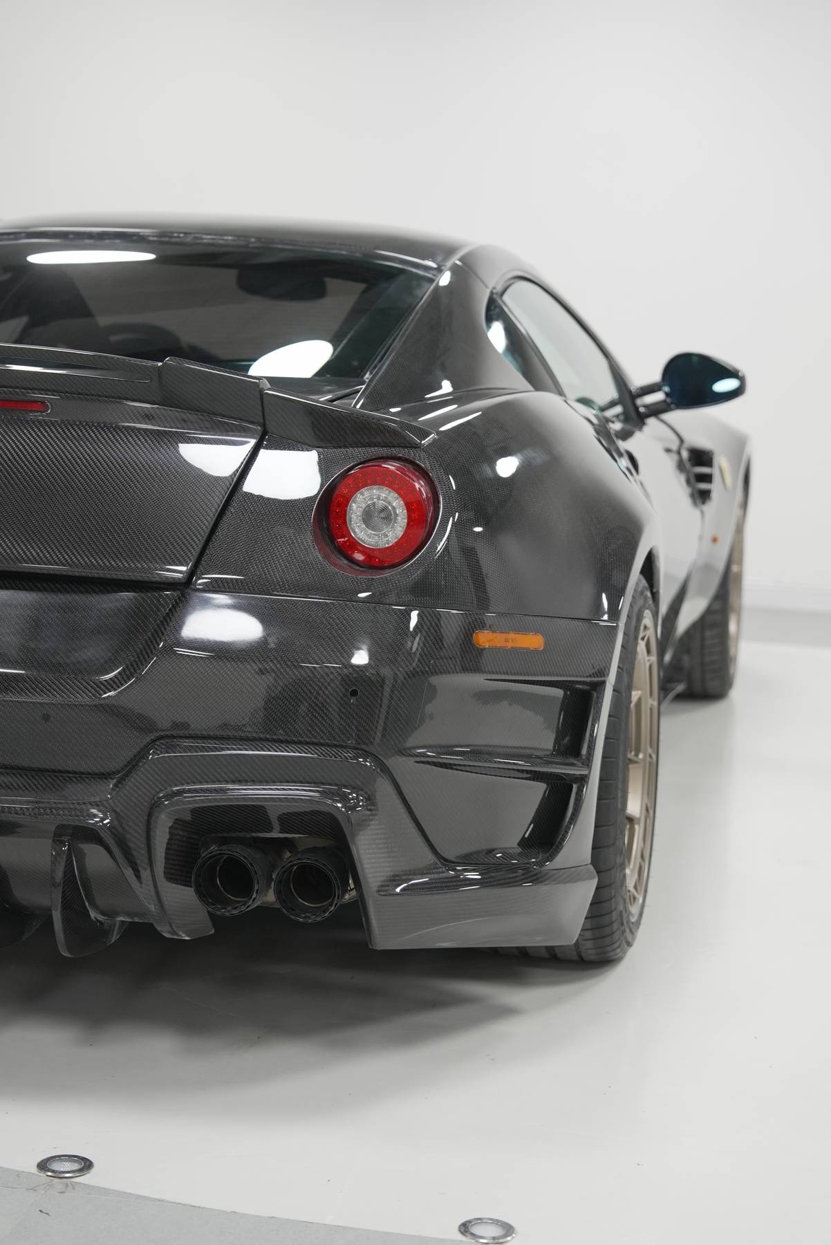 Glossy finished exposed-carbon surface, rear three-quarter