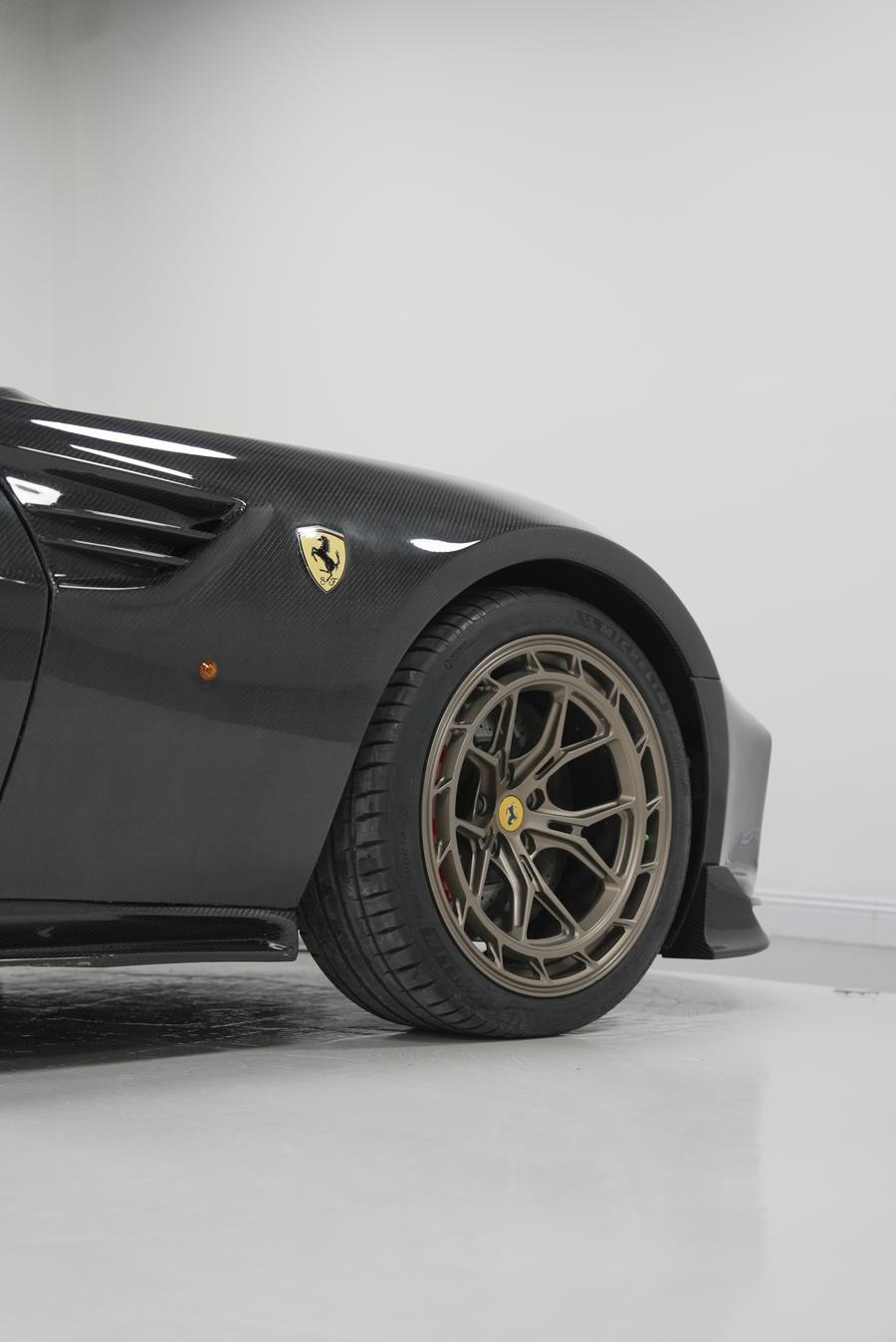 Classic GT silhouette rebodied in exposed carbon fibre